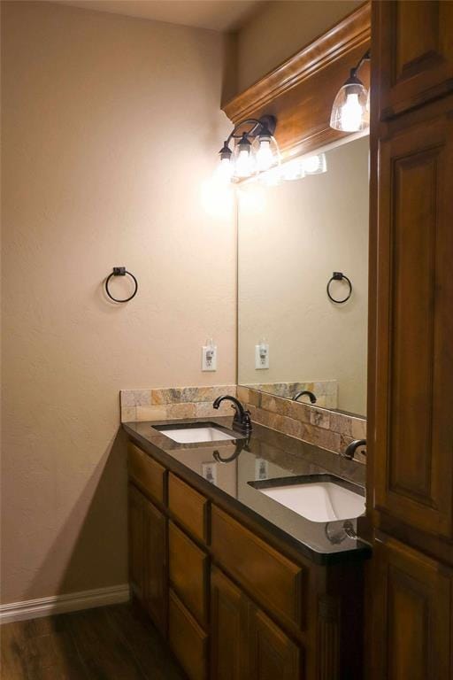 1417 Dustbowl Ln, Altus, OK 73521 - full bathroom with double vanity, wood finished floors, and baseboards