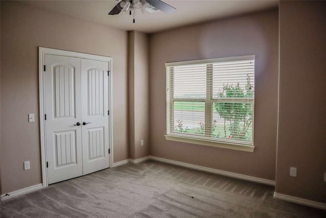 1417 Dustbowl Ln, Altus, OK 73521 - unfurnished bedroom featuring carpet flooring, multiple windows, baseboards, and a closet