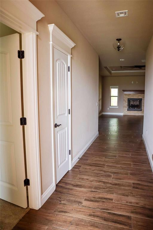 1417 Dustbowl Ln, Altus, OK 73521 - corridor featuring wood finished floors and baseboards