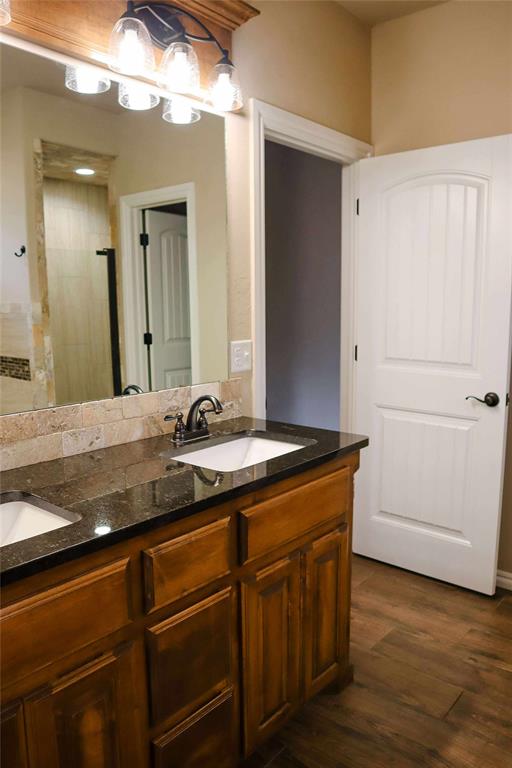 1417 Dustbowl Ln, Altus, OK 73521 - bathroom with double vanity and wood finished floors