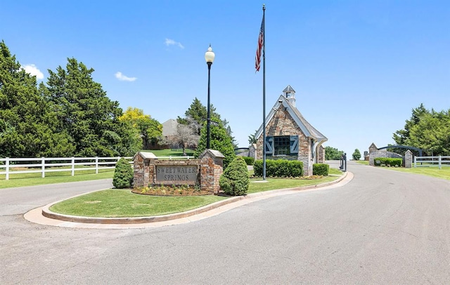 4706 Red Hawk St, Guthrie, OK 73044 - view of asphalt street with street lighting and curbs