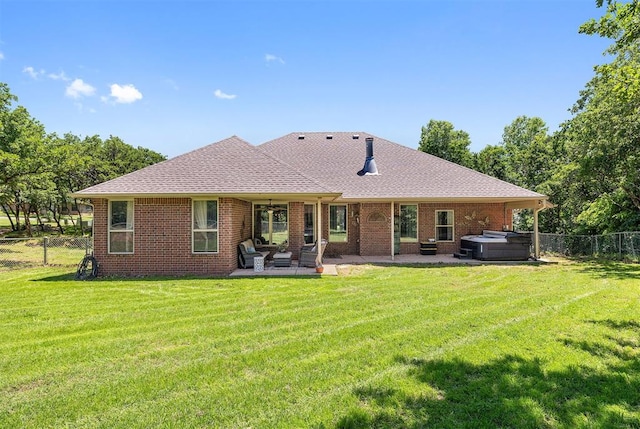 4706 Red Hawk St, Guthrie, OK 73044 - rear view of house with a hot tub, a patio area, a shingled roof, and brick siding