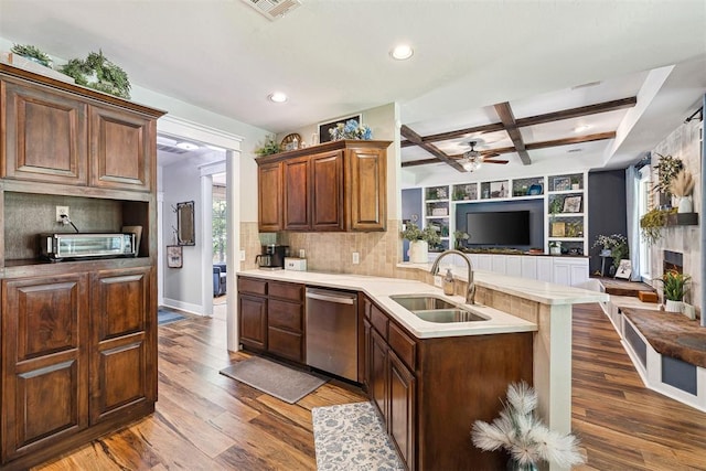 4706 Red Hawk St, Guthrie, OK 73044 - kitchen with stainless steel dishwasher, a sink, coffered ceiling, a peninsula, and ceiling fan