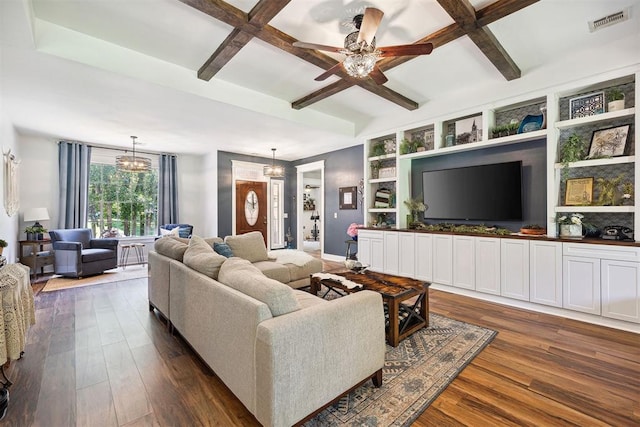 4706 Red Hawk St, Guthrie, OK 73044 - living area featuring dark wood-style flooring, a chandelier, ceiling fan, beamed ceiling, and coffered ceiling