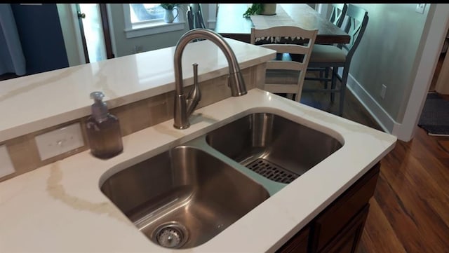 4706 Red Hawk St, Guthrie, OK 73044 - kitchen view of a sink, light countertops, and wood finished floors