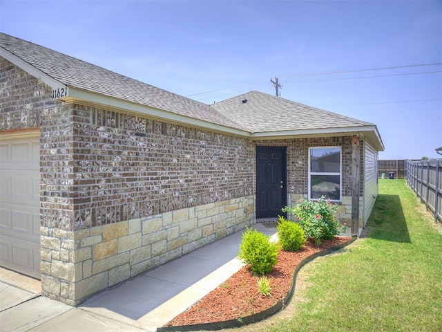 11621 Jude Way, Yukon, OK 73099 - doorway to property with a shingled roof, a garage, and brick siding