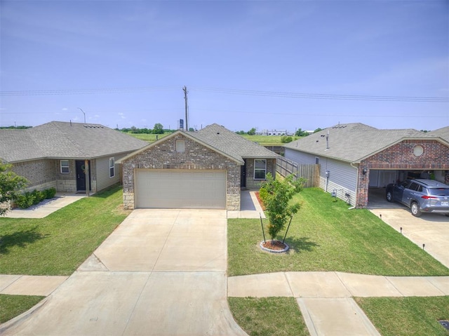 11621 Jude Way, Yukon, OK 73099 - view of front of property featuring an attached garage, driveway, and brick siding