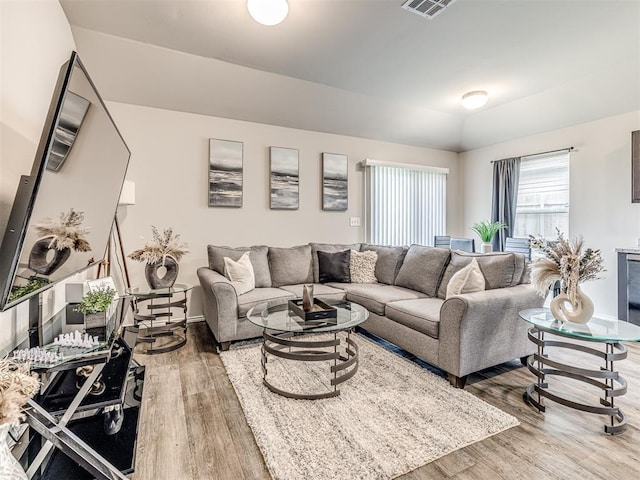 11621 Jude Way, Yukon, OK 73099 - living room with wood finished floors and vaulted ceiling