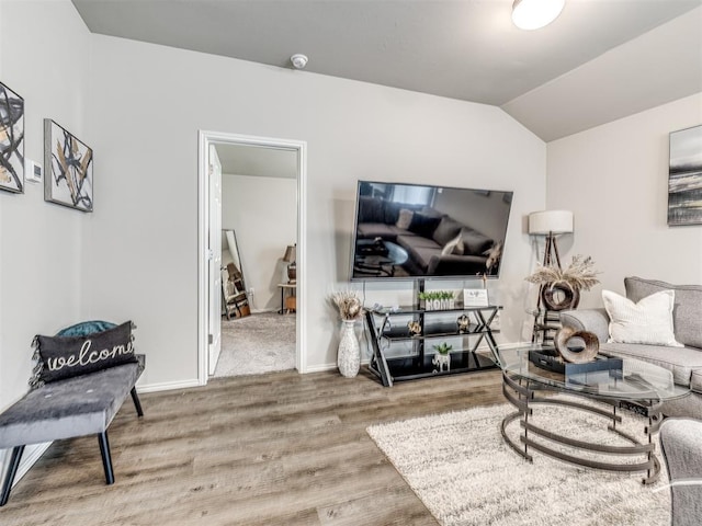 11621 Jude Way, Yukon, OK 73099 - living room featuring wood finished floors, baseboards, and vaulted ceiling