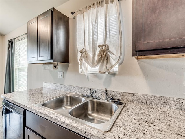 11621 Jude Way, Yukon, OK 73099 - kitchen view of dishwasher, a sink, dark brown cabinets, and light countertops