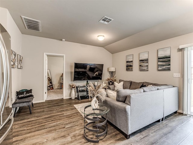 11621 Jude Way, Yukon, OK 73099 - living room with wood finished floors, lofted ceiling, and baseboards