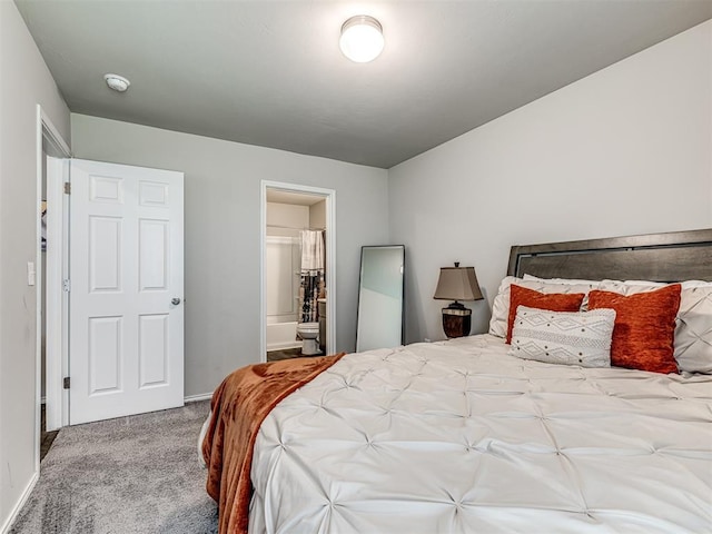 11621 Jude Way, Yukon, OK 73099 - carpeted bedroom with baseboards and ensuite bath