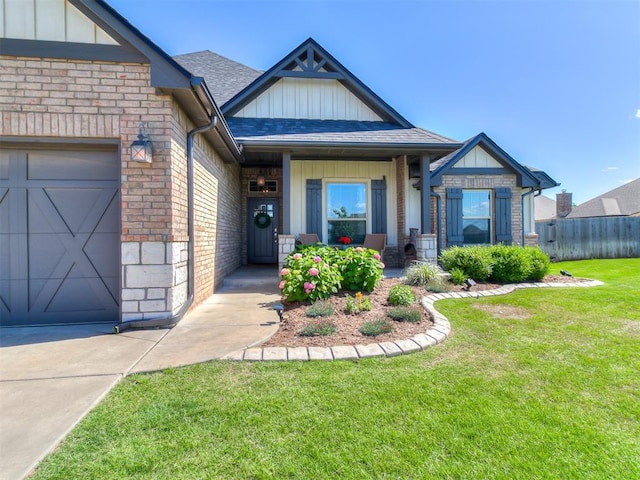 12801 Red Spruce Cir, Oklahoma City, OK 73142 - craftsman house featuring board and batten siding, brick siding, a garage, and a shingled roof
