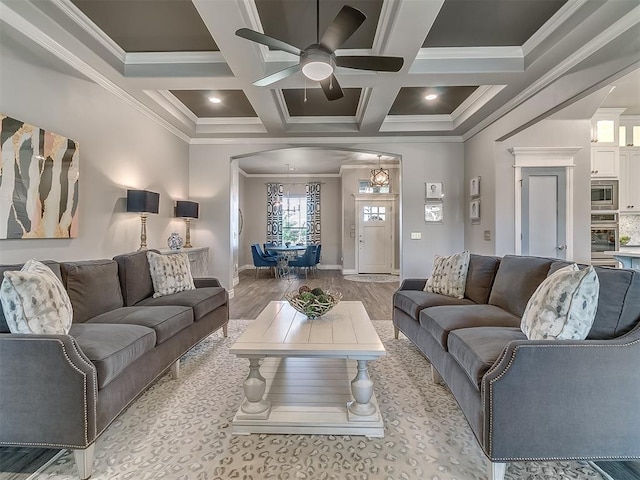 12801 Red Spruce Cir, Oklahoma City, OK 73142 - living area with arched walkways, ceiling fan, crown molding, coffered ceiling, and beam ceiling