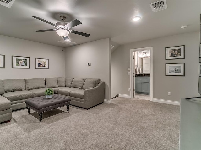 12801 Red Spruce Cir, Oklahoma City, OK 73142 - living area with light colored carpet, a ceiling fan, and baseboards