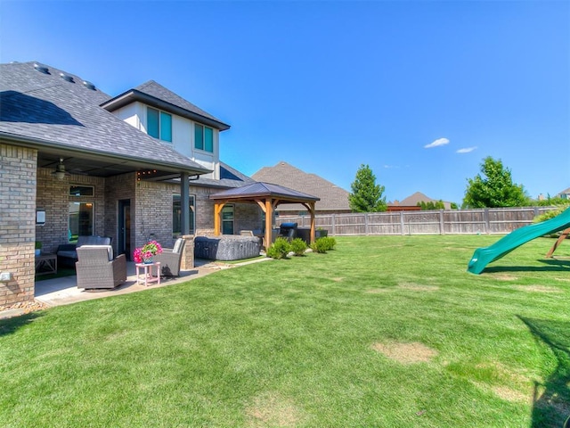 12801 Red Spruce Cir, Oklahoma City, OK 73142 - view of yard featuring a gazebo, outdoor lounge area, a patio area, and a ceiling fan