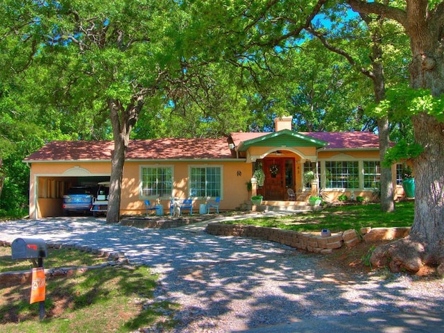 43 W Shore Dr, Arcadia, OK 73007 - single story home featuring a chimney, driveway, and a carport
