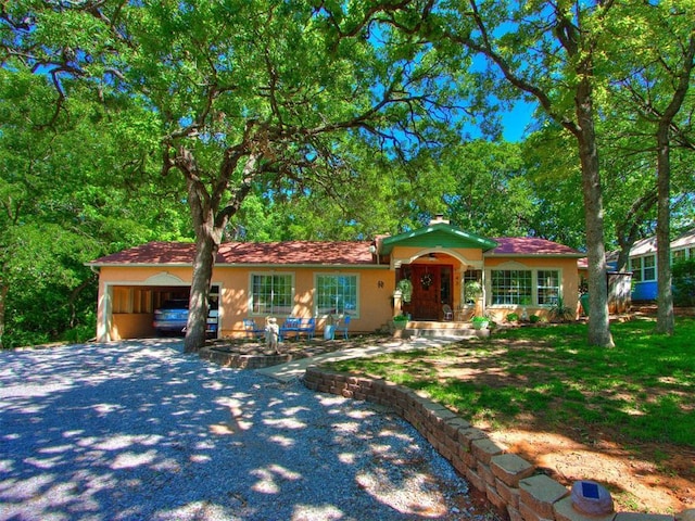 43 W Shore Dr, Arcadia, OK 73007 - view of front of home featuring a carport and stucco siding