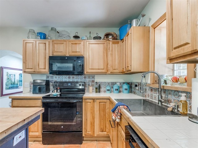 43 W Shore Dr, Arcadia, OK 73007 - kitchen with black appliances, a sink, light brown cabinetry, arched walkways, and decorative backsplash