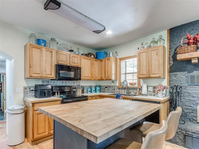 43 W Shore Dr, Arcadia, OK 73007 - kitchen featuring black appliances, butcher block counters, a sink, light brown cabinetry, and a kitchen island