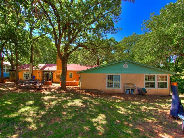 43 W Shore Dr, Arcadia, OK 73007 - back of house featuring a lawn