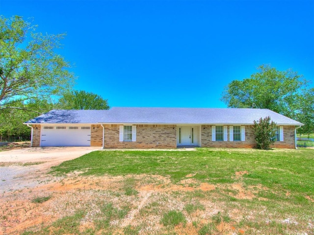 18 Whispering Meadows Rd, Shawnee, OK 74804 - single story home featuring dirt driveway, a garage, a front yard, and brick siding