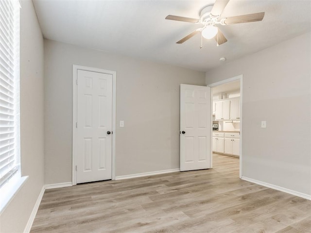 18 Whispering Meadows Rd, Shawnee, OK 74804 - unfurnished bedroom featuring light wood-type flooring, baseboards, and ceiling fan