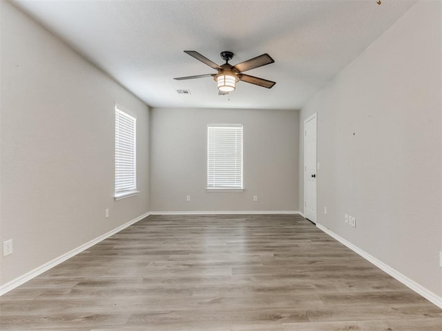 18 Whispering Meadows Rd, Shawnee, OK 74804 - spare room with a ceiling fan, light wood-style floors, and baseboards