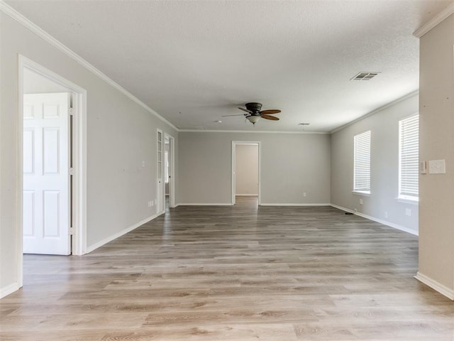 18 Whispering Meadows Rd, Shawnee, OK 74804 - unfurnished room with a ceiling fan, crown molding, baseboards, and light wood finished floors