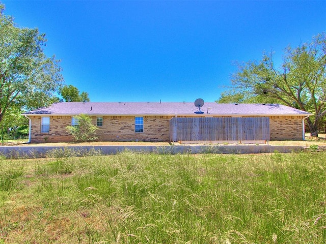 18 Whispering Meadows Rd, Shawnee, OK 74804 - rear view of house featuring brick siding