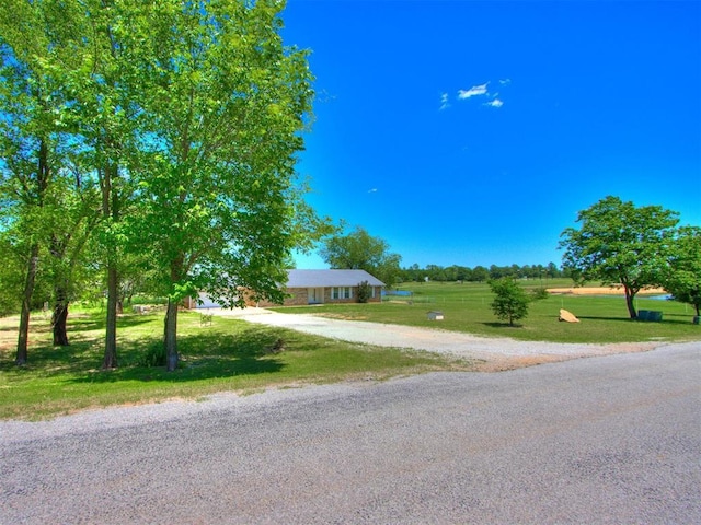 18 Whispering Meadows Rd, Shawnee, OK 74804 - view of front of house with a front lawn and driveway