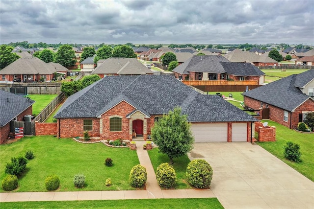 3417 Lyle Rd, Weatherford, OK 73096 - view of front of property with an attached garage, driveway, a residential view, and brick siding