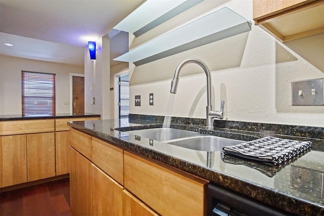 600 NW 4th St Unit 319N, Oklahoma City, OK 73102 - kitchen featuring dark stone countertops, dark wood finished floors, and dishwasher