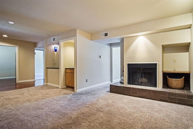 600 NW 4th St Unit 319N, Oklahoma City, OK 73102 - unfurnished living room featuring carpet, a brick fireplace, and recessed lighting