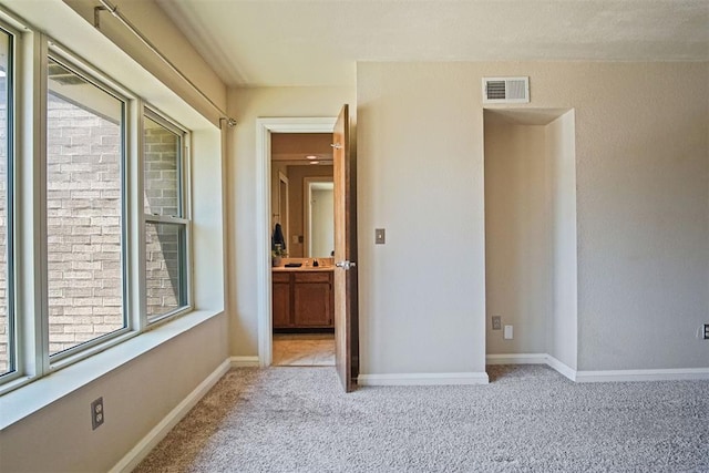 600 NW 4th St Unit 319N, Oklahoma City, OK 73102 - unfurnished bedroom with carpet flooring and ensuite bath