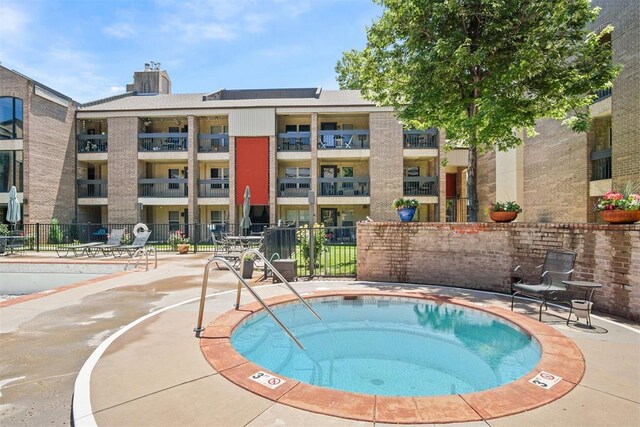 600 NW 4th St Unit 319N, Oklahoma City, OK 73102 - view of pool with a hot tub