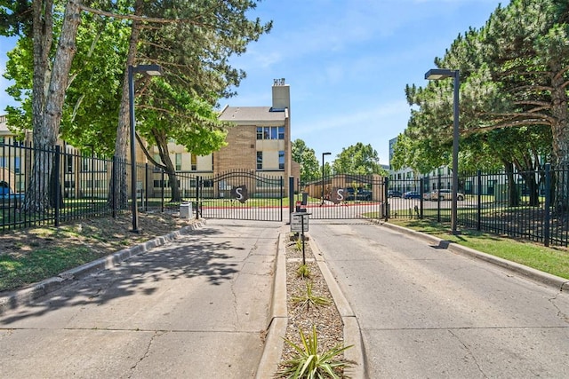 600 NW 4th St Unit 319N, Oklahoma City, OK 73102 - view of street featuring curbs, a gated entry, a gate, and street lighting