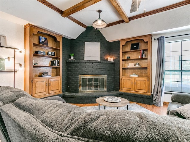 4205 Sooner Cir, Edmond, OK 73034 - living room with wood finished floors, a fireplace, and built in shelves