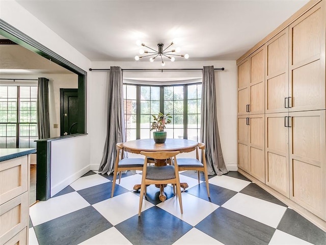 4205 Sooner Cir, Edmond, OK 73034 - dining room with tile patterned floors, plenty of natural light, baseboards, and a chandelier