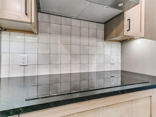 4205 Sooner Cir, Edmond, OK 73034 - kitchen featuring decorative backsplash, extractor fan, and black electric cooktop