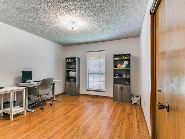 4205 Sooner Cir, Edmond, OK 73034 - home office with wood finished floors and a textured ceiling