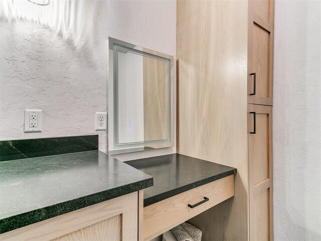 4205 Sooner Cir, Edmond, OK 73034 - bathroom with a textured wall and vanity