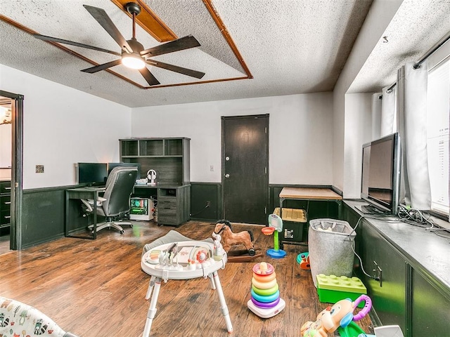 4205 Sooner Cir, Edmond, OK 73034 - office area with a textured ceiling, ceiling fan, a wainscoted wall, and wood finished floors