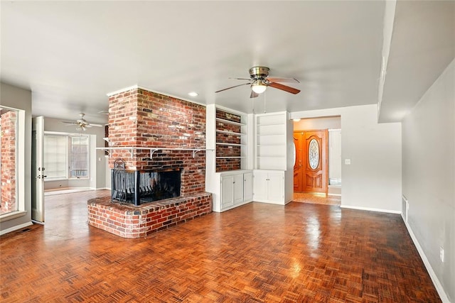6005 NW Kingston Rd, Oklahoma City, OK 73122 - unfurnished living room featuring a ceiling fan, baseboards, and a fireplace
