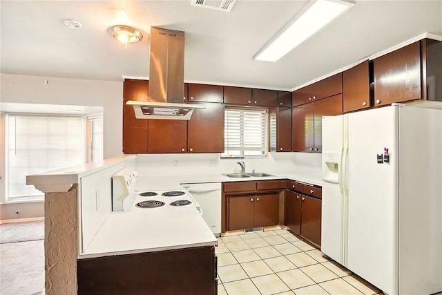 6005 NW Kingston Rd, Oklahoma City, OK 73122 - kitchen featuring white appliances, island range hood, a sink, light countertops, and a peninsula