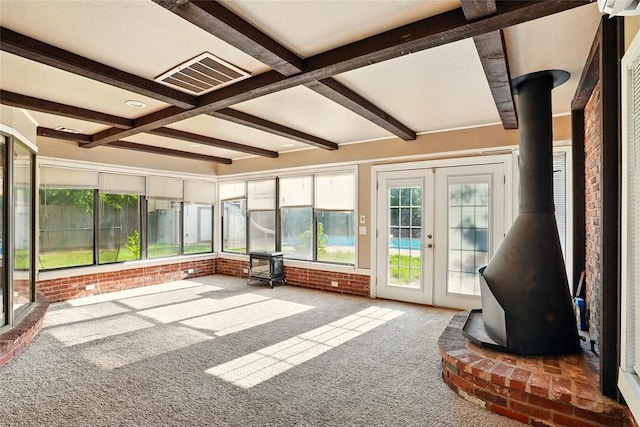 6005 NW Kingston Rd, Oklahoma City, OK 73122 - unfurnished sunroom with a wood stove, beamed ceiling, and french doors