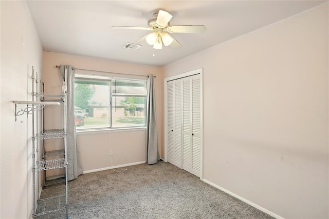 6005 NW Kingston Rd, Oklahoma City, OK 73122 - unfurnished bedroom with carpet, baseboards, a closet, and a ceiling fan