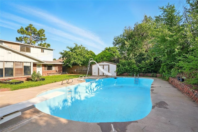 6005 NW Kingston Rd, Oklahoma City, OK 73122 - outdoor pool featuring a water slide, a diving board, and a patio area