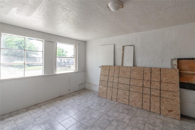 3917 SE 12th St, Oklahoma City, OK 73115 - unfurnished bedroom with a textured ceiling and tile patterned flooring