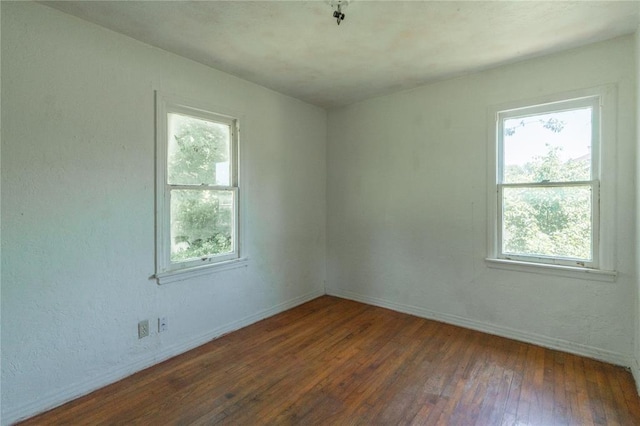 3917 SE 12th St, Oklahoma City, OK 73115 - unfurnished room with hardwood / wood-style floors, plenty of natural light, and baseboards